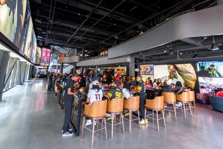 Cosm Fall Sports Guide: Ticket Types, Venues and What to Know Football fans watching an NFL game inside Cosm Atlanta's immersive Dome