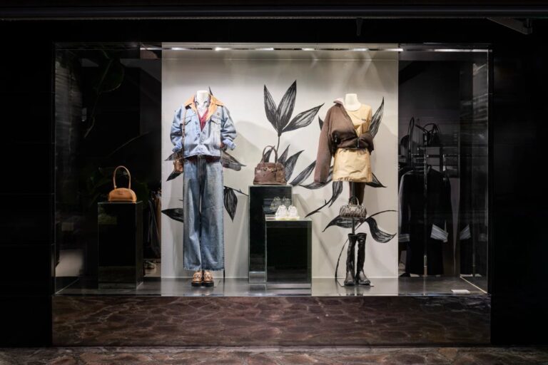 Julian Fashion Fall Layering Guide: How to Choose a Designer Coat Julian Fashion boutique window displaying layered jackets, knitwear, bags and boots